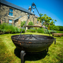 Load image into Gallery viewer, Bbq cooking tripod being used with a fire pit in the garden