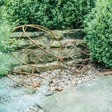 Load image into Gallery viewer, A XL rustic garden ball sat alongside a Large rustic garden ball in the garden. 
