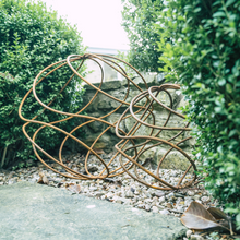 Load image into Gallery viewer, A XL rustic garden ball and a large rustic garden ball sat beside eachother in the garden. 
