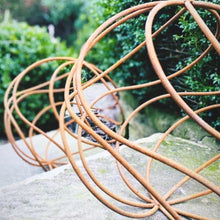 Load image into Gallery viewer, A 40cm rustic garden ball sat on a garden step with the smaller 34cm rustic garden ball on a step. 
