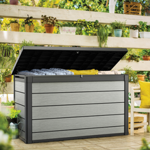 Load image into Gallery viewer, The Keter Denali Duotech Garden Box 757L outside in the garden. 

