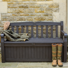 Load image into Gallery viewer, The Keter Iceni Storage Bench 265L Brown with wellies and a coat on the bench. 
