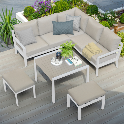 The Titchwell mini corner lounge set with table on some garden decking. 
