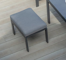 Load image into Gallery viewer, The Titchwell mini corner lounge stool in grey on some decking. 
