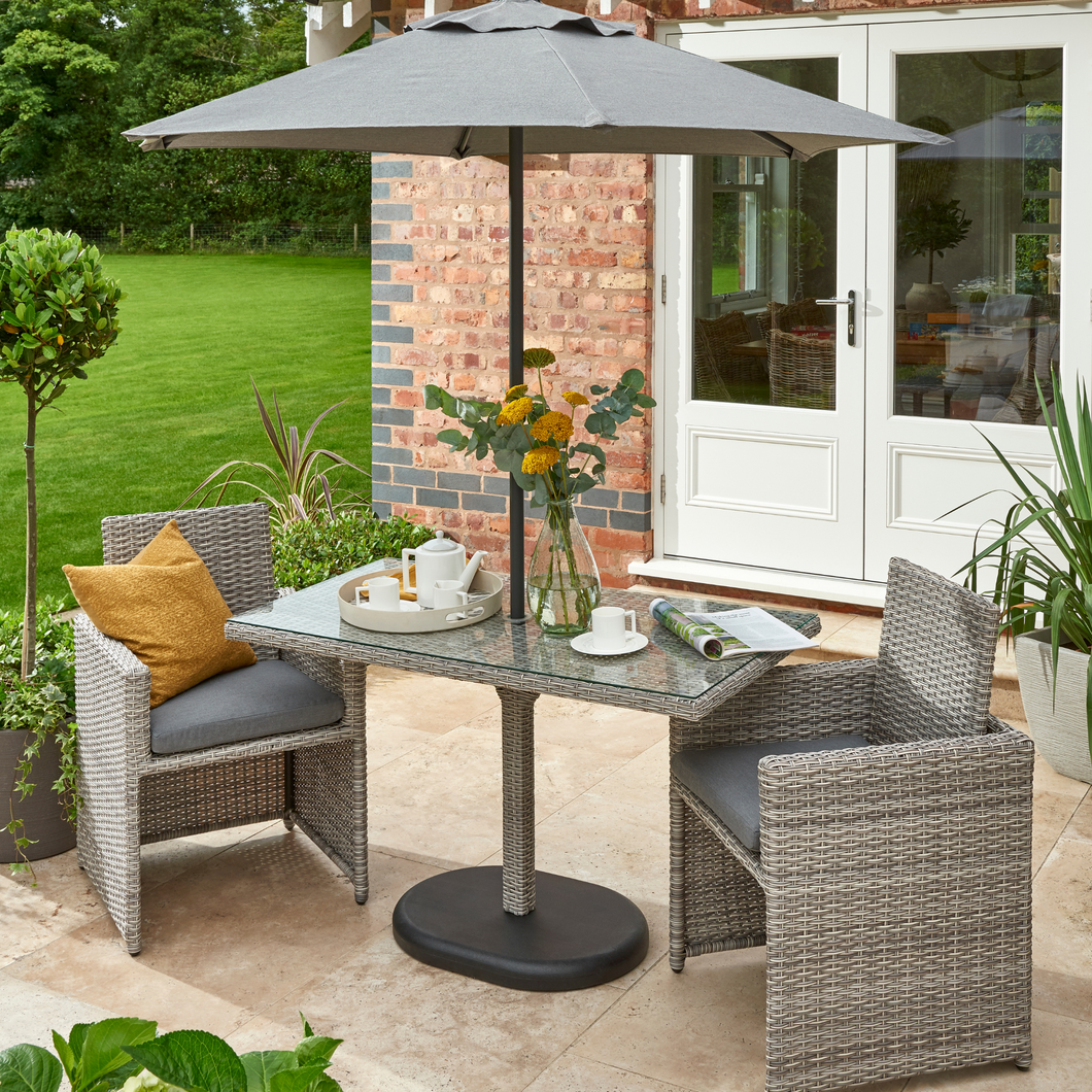 The Wensum Bistro Set outside in the garden