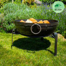 Load image into Gallery viewer, 80cm fire pit in garden on a metal stand with wood inside
