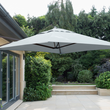 Load image into Gallery viewer, The Cantilever parasol wall mounted outside in the garden.
