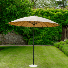 Load image into Gallery viewer, The taupe geisha parasol in the garden. 
