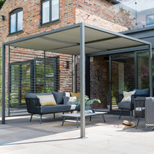 Load image into Gallery viewer, The Sliding Roof Gazebo 2.8m outdoors with the top canopy covering the garden furniture. 
