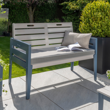 Load image into Gallery viewer, The Florenity Galaxy two seat bench outside in the garden.
