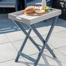 Load image into Gallery viewer, The Florenity Galaxy folding butler tray outside in the garden. 
