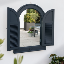 Load image into Gallery viewer, The Florenity Galaxy Outdoor Arch Mirror on a white wall with opened front doors. 
