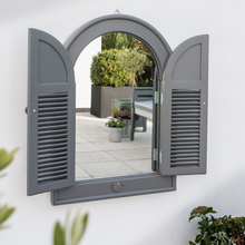 Load image into Gallery viewer, The Florenity Grigio Outdoor Arch Mirror on a white washed wall. 
