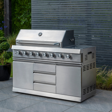 Load image into Gallery viewer, The Norfolk Grills absolute 6 burner Free Standing Grill with Side Burner and cabinet outside in the garden. 
