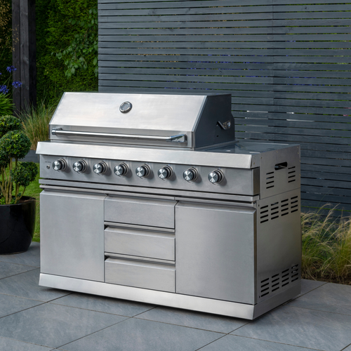 The Norfolk Grills absolute 6 burner Free Standing Grill with Side Burner and cabinet outside in the garden. 