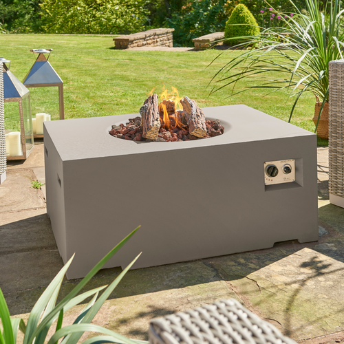 The Cocoon grey rectangular fire bowl in the garden.  