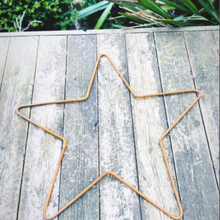 Load image into Gallery viewer, Rustic garden star on grey decking in the garden with some grass over lapping 
