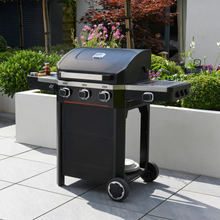 Load image into Gallery viewer, The Norfolk Grills Atlas 300 with Side Burner outside in the garden. 
