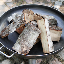 Load image into Gallery viewer, Cook King Bali fire pit with wood logs inside and two handles.
