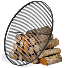 Load image into Gallery viewer, Cook King black steel grill leant against a pile of wood logs on a white background. 
