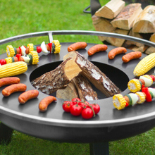 Load image into Gallery viewer, Cook King grill plate shown on a fire pit without the grill.  
