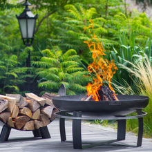 Load image into Gallery viewer, The Cook King Viking Fire Bowl with fire lit in garden
