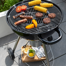 Load image into Gallery viewer, The Corus bbq grill with sweetcorn, tomatoes, peppers, burgers and sausage cooking. 
