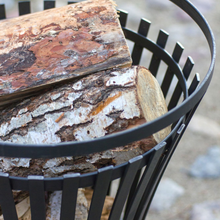 Load image into Gallery viewer, The Cook King Flame Fire Basket with chopped wooden logs inside. 
