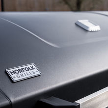 Load image into Gallery viewer, The Norfolk Grills logo shown on the lid of the Norfolk Grills Infinity 500 Gas BBQ. 

