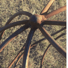 Load image into Gallery viewer, Top of the large rustic garden ball sat on some green grass. 
