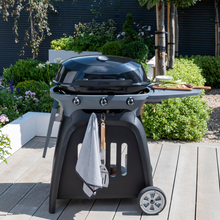 Load image into Gallery viewer, The Norfolk grills N-Grill gas BBQ 3 burner outside in the garden. 
