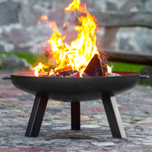 Load image into Gallery viewer, The Cook King Polo fire pit with fire lit in the garden.
