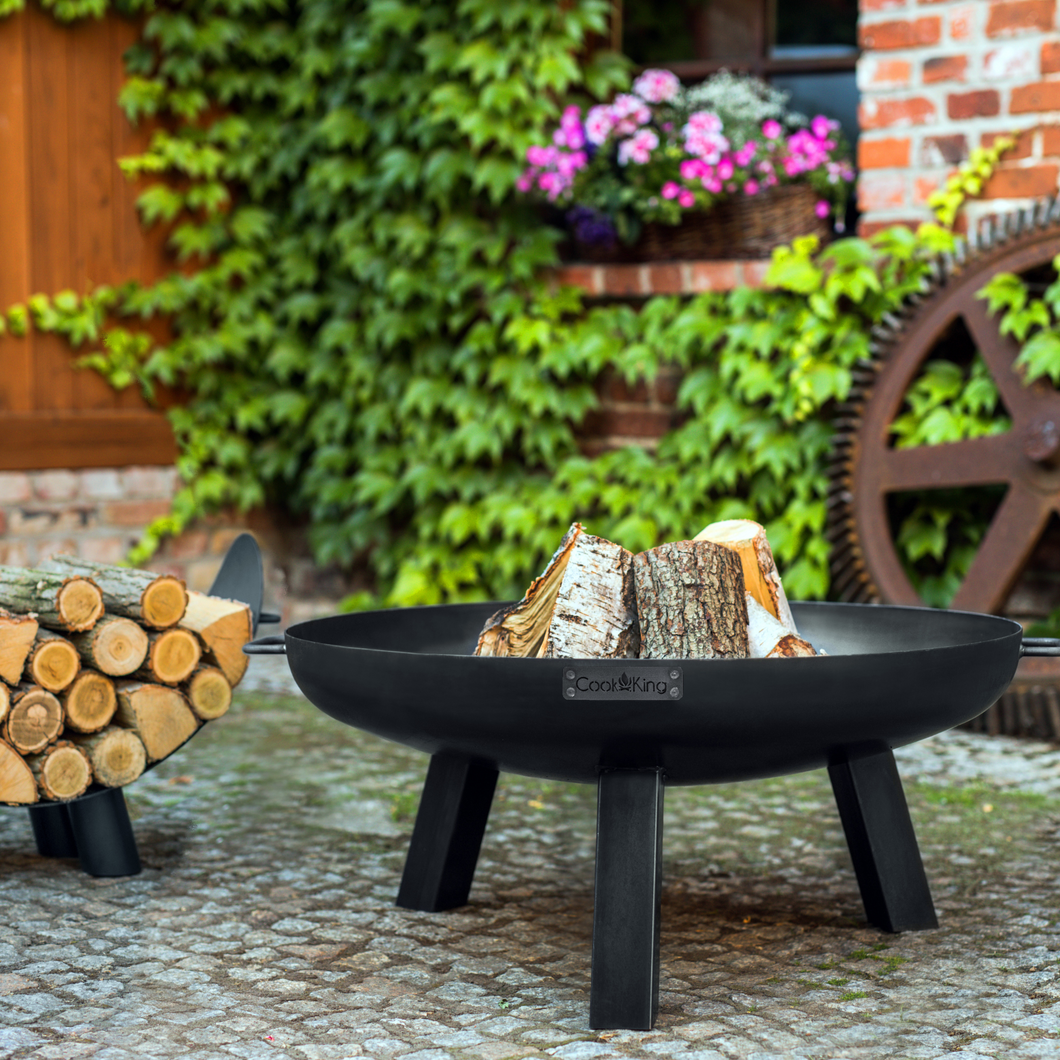 The Cook King Cook King Polo Fire Pit in the garden.
