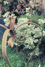 Load image into Gallery viewer, Rustic garden crown sat in the garden
