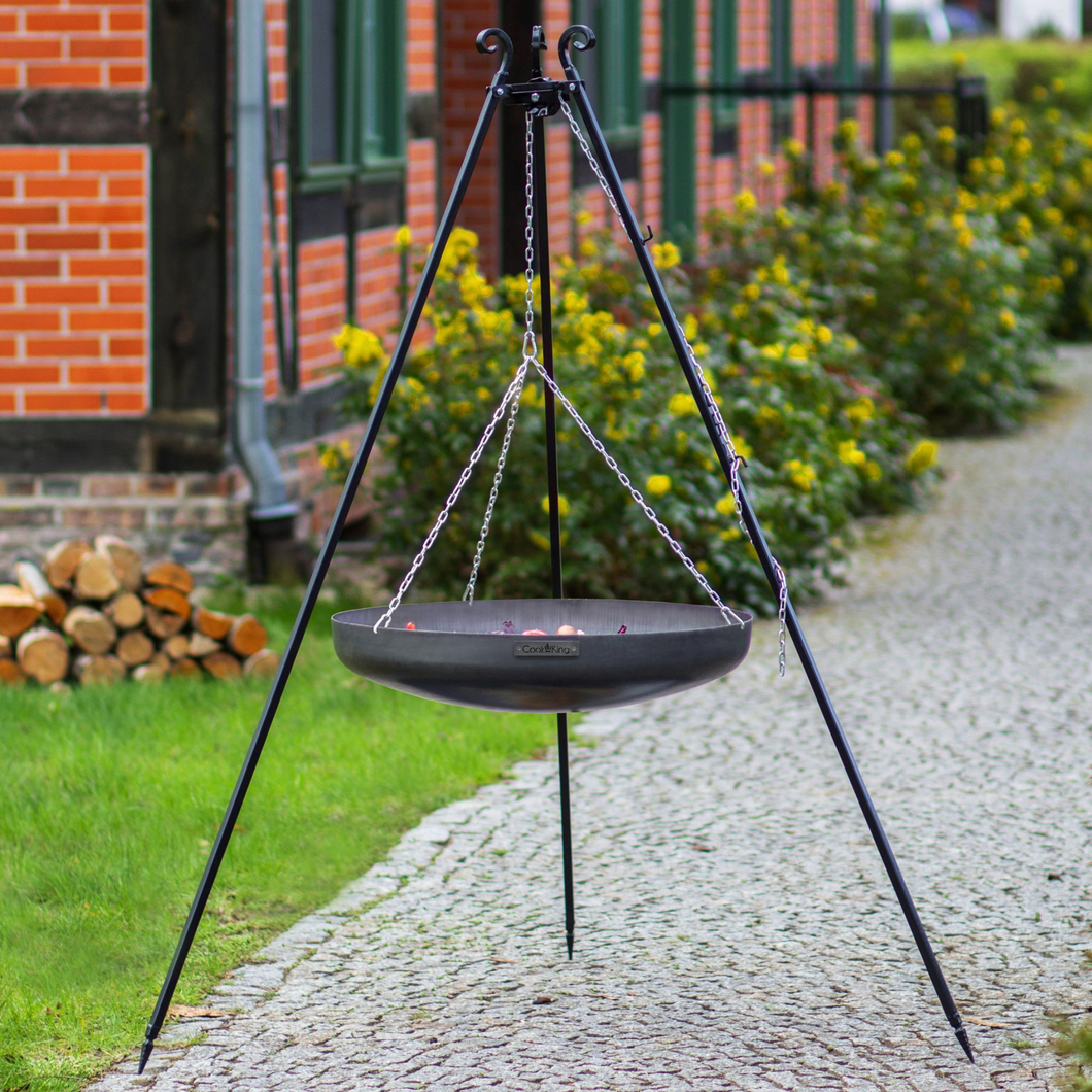 The Cook King Tripod with Steel Wok outside in the garden