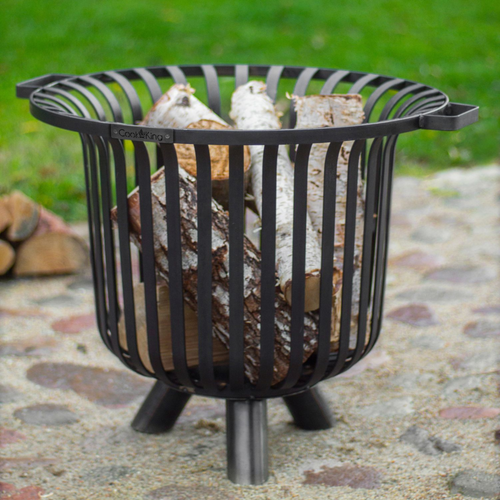 The Cook King Verona 60cm Fire Basket outside in the garden.