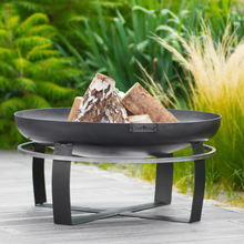 Load image into Gallery viewer, The Cook King Viking Fire Bowl sat in the garden. 
