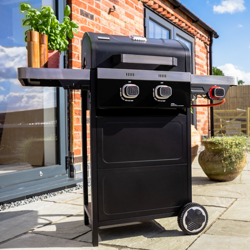 The Norfolk Grills Vista 200 Gas BBQ Grill with Side Burner outside in the garden. 