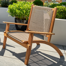 Load image into Gallery viewer, The walden folding chair outside in the garden patio.  
