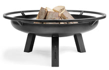 Load image into Gallery viewer, The Porto fire pit with wood inside, on a white background. 
