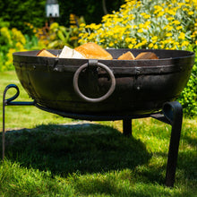 Load image into Gallery viewer, 60cm wood fire pit with firewood inside in the garden . 
