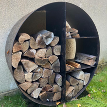 Load image into Gallery viewer, The wood log store in the garden at the side of the wall. 
