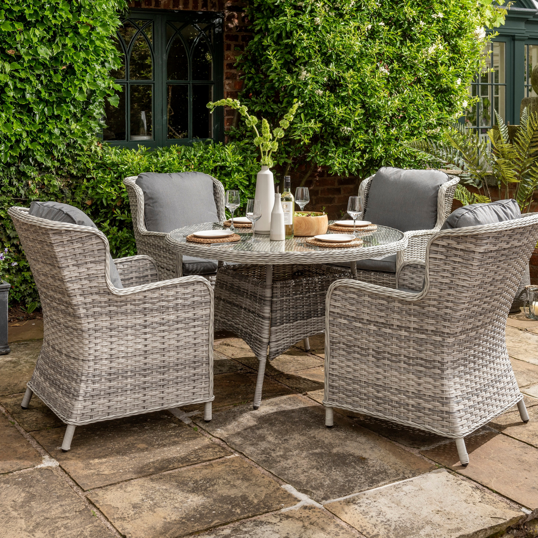The Wroxham 4 seat dining set on a garden patio. 